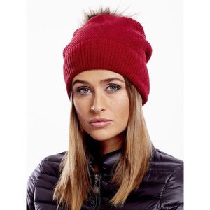 Red cap with fur pompom vyobraziť