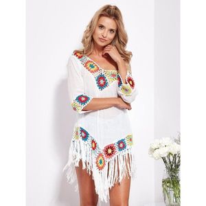 Ethno-style white tunic with colored crocheting vyobraziť
