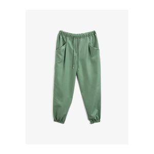 Koton Women's Green Pocket Waist Bagged Trousers vyobraziť