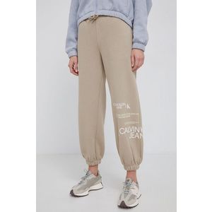 Nohavice Calvin Klein Jeans dámske, priehľadná farba, s potlačou vyobraziť