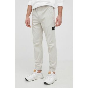 Nohavice Calvin Klein Jeans pánske, šedá farba, jogger vyobraziť