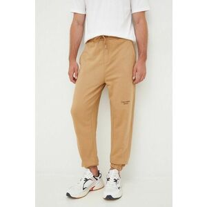 Bavlnené tepláky Calvin Klein Jeans pánske, hnedá farba, s potlačou vyobraziť