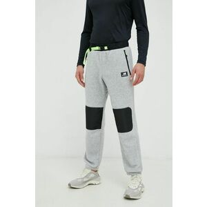 Nohavice New Balance pánske, šedá farba, s nášivkou vyobraziť